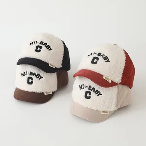 Detail of warm winter baby baseball hats showing fleece texture and quited fabric variety