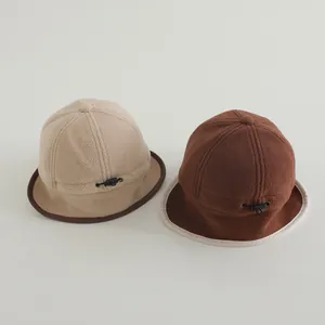 Detail of fleece winter hats with adjustable drawstring and contrast brim binding