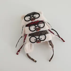 Winter plush baby trapper hat with leopard print pom-pom ears and cute glasses decor
