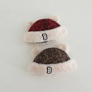 Detail showing plush leopard print bear ear hats with warm faux fur and B embroidery