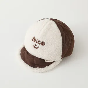 Detail of baby winter baseball cap featuring fleece texture and Nice embroidery