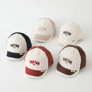 Detail view of five colors of quilted Boston 1630 baseball caps for toddlers