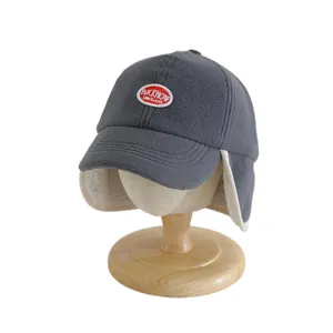 Toddler winter baseball cap with ear flaps in dark grey fleece with logo detail