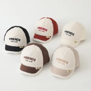 Top view of five colorful quilted sherpa baseball caps for kids with letter embroidery