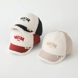 Detail of BOSTON embroidered sherpa baseball caps with quilted brims in three colors