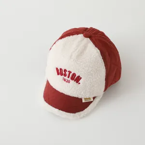 Close-up of quilted winter cap with Boston 1630 embroidery and soft fleece fabric