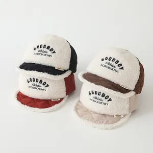 Close-up of winter baby caps in four colors with lamb wool texture and NICE smile embroidery