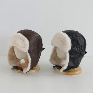 Detail of leather trapper hats with thick faux fur lining and star patch for winter