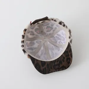 Detail view of leopard print faux fur baby hat with breathable mesh lining and stitching