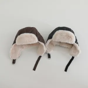 Detail of waterproof PU leather trapper hats with warm faux fur lining and star patches