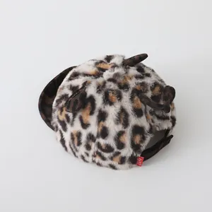 Detail of baby leopard print baseball cap featuring soft faux fur texture and cute ears