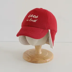 Winter baby baseball cap with red fleece, earflaps and GOOD LUCK embroidery