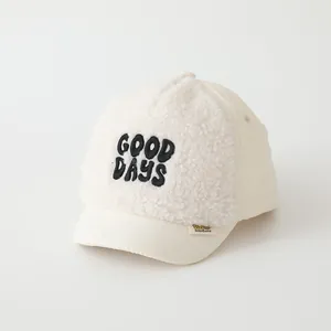 Kids sherpa baseball cap in cream with GOOD DAYS embroidery and quilted details