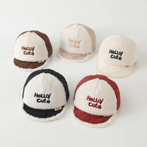 Detailed view of baby baseball caps in five colors with soft fleece and letter embroidery