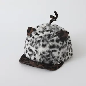 Detail of leopard print plush baby hat with cat ears and a soft brown brim