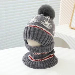 Winter knit hat and neck warmer set for children with gray pom-pom and snowflake patterns