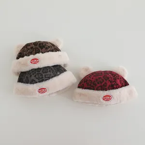Leopard print winter baby hats with dual pom-poms and warm fleece lining in three colors