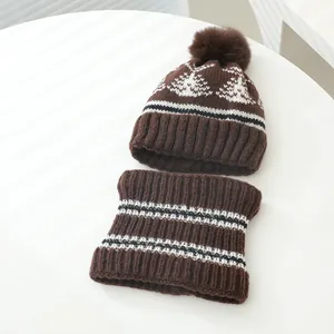 Winter knit hat and neck warmer set with brown Nordic patterns and faux fur pompom