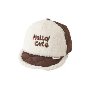 Toddler winter baseball cap in brown quilted fabric and white faux shearling with NICE text