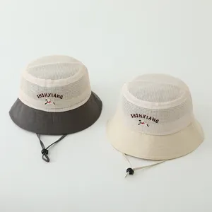 Close-up of kids' summer sun hat with breathable mesh panels and adjustable wind cord