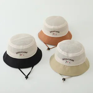 Detail view of breathable mesh crown and adjustable windproof cord on kids sun hats