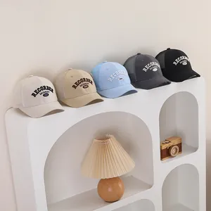 Five assorted mesh baseball caps with recorder moment 1983 embroidery on display stand