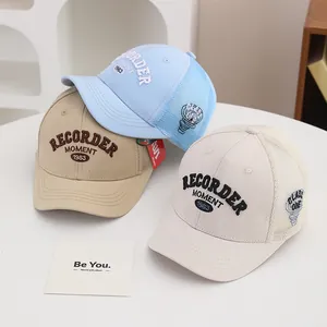 Three embroidered baseball caps in blue, khaki, and beige with breathable mesh panels