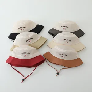 Close-up of children's mesh sun hats in multiple colors with adjustable chin straps