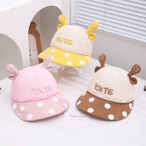 Detail of the large mesh ventilation and cute smiley face antenna on toddler sun caps