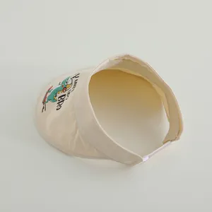Beige Sonnenblende für Kinder mit niedlichem Dinosaurier-Druck und Klettverschluss