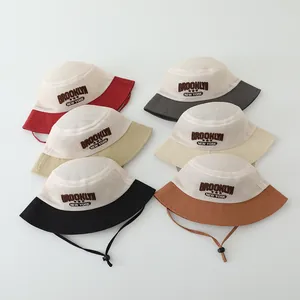 Mesh toddler sun hat detail showing colorful palette and adjustable chin strap