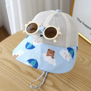 Detail of baby sun hat with mesh top, bear print brim, and decorative sunglasses