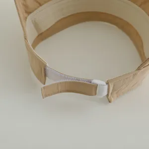 Macro detail of adjustable Velcro strap and soft sweatband on kids sun visor hat