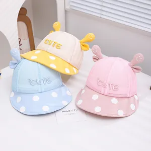 Three cute summer baby mesh hats in pink, blue and yellow with cute polka dot brims