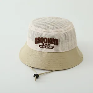 Detail of mesh fisherman hat featuring Brooklyn New York embroidery and adjustable cord