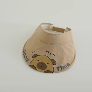 Detail of khaki sun hat featuring cute cartoon animal print and quick-dry fabric texture