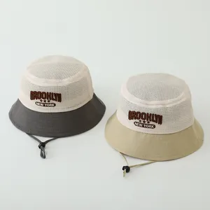 Detail of mesh sun hat for kids featuring Brooklyn New York embroidery and chin strap