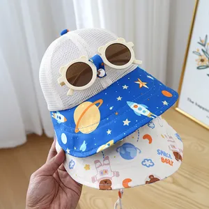 Close-up of baby sun hat set featuring space bear prints and breathable mesh fabric