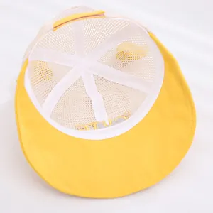 Detail of yellow baby mesh sun hat with CUTE embroidery and breathable mesh structure