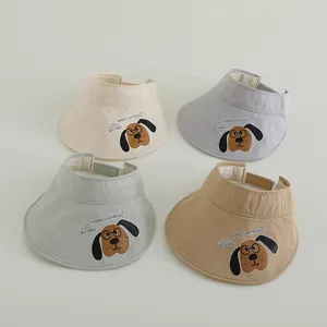 Detail of four quick-dry children's sun hats in beige, grey, green, and brown colors