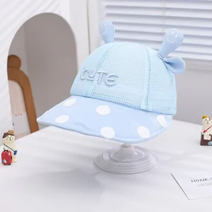 Cute light blue baby sun hat with mesh top, polka dot brim, and cartoon ears decoration