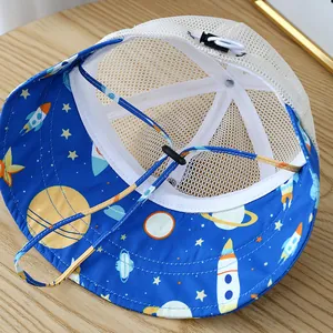 Detail of baby sun hat showing breathable white mesh top and blue space-themed printed brim