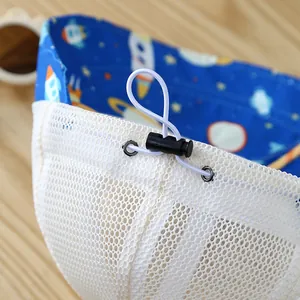 Detailed macro view of baby sun hat with breathable mesh and adjustable elastic cord
