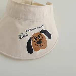 Detail of breathable beige sun visor with cartoon print and slogan for kids