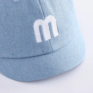 Kids light blue denim baseball cap with white embroidered M letter and short brim