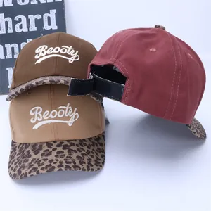 Detail of adjustable Velcro strap and leopard print brim on stylish kids baseball caps