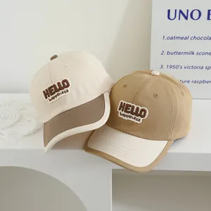 Kids baseball cap with HELLO embroidery in cream and khaki contrast color scheme