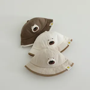 Cute embroidered bear cotton bucket hats for toddlers in brown, cream and beige colors