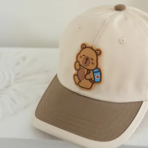 Kids baseball cap with cute cartoon bear and blue backpack in beige and brown colors