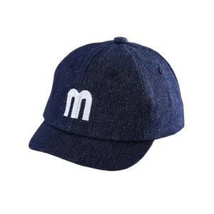 Kids navy denim baseball cap with white letter M embroidery and short flat brim